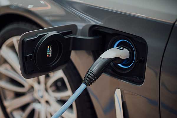 Do Electric Cars Use Gas | Charging Post Electric Car Photo