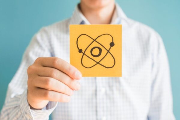 Fission vs. Fusion Illustration Man Holds up Sign