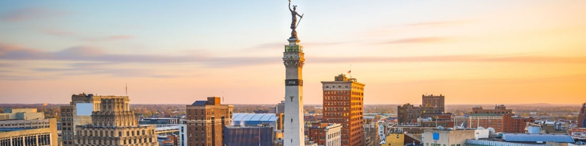 Indianapolis, Indiana, USA skyline over Monument Circle at dusk.