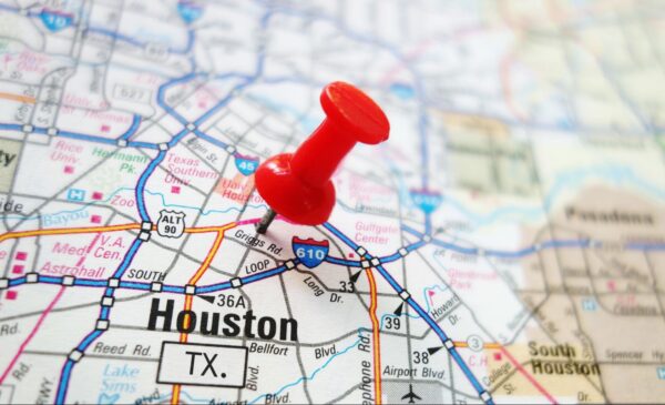 A red pin stuck into a map