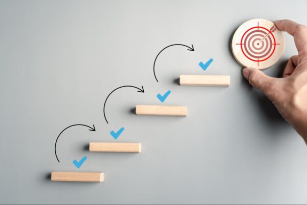 An image of a person rolling a disk down some steps
