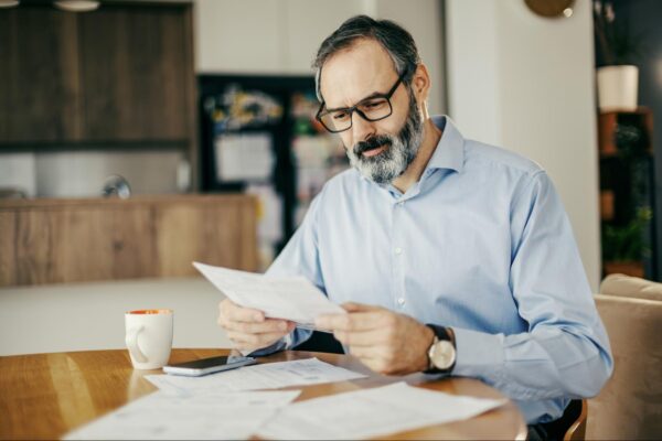 reading-energy-bill-2 man reviewing energy bill